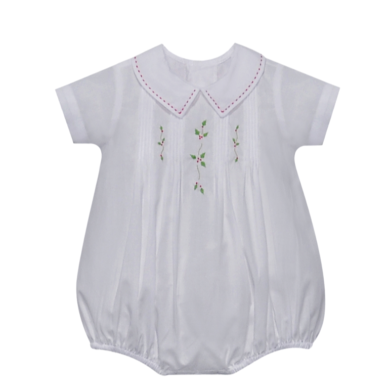 White baby romper with embroidered details on a white background